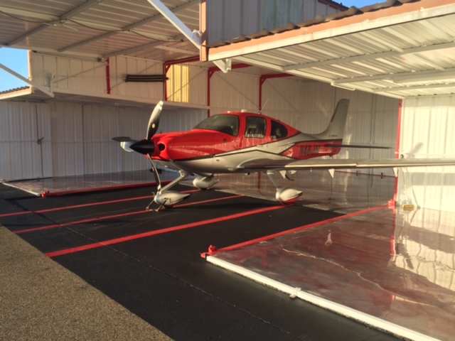 Private Airplane Hanger with metallic epoxy and urethane cement - featuring private plane