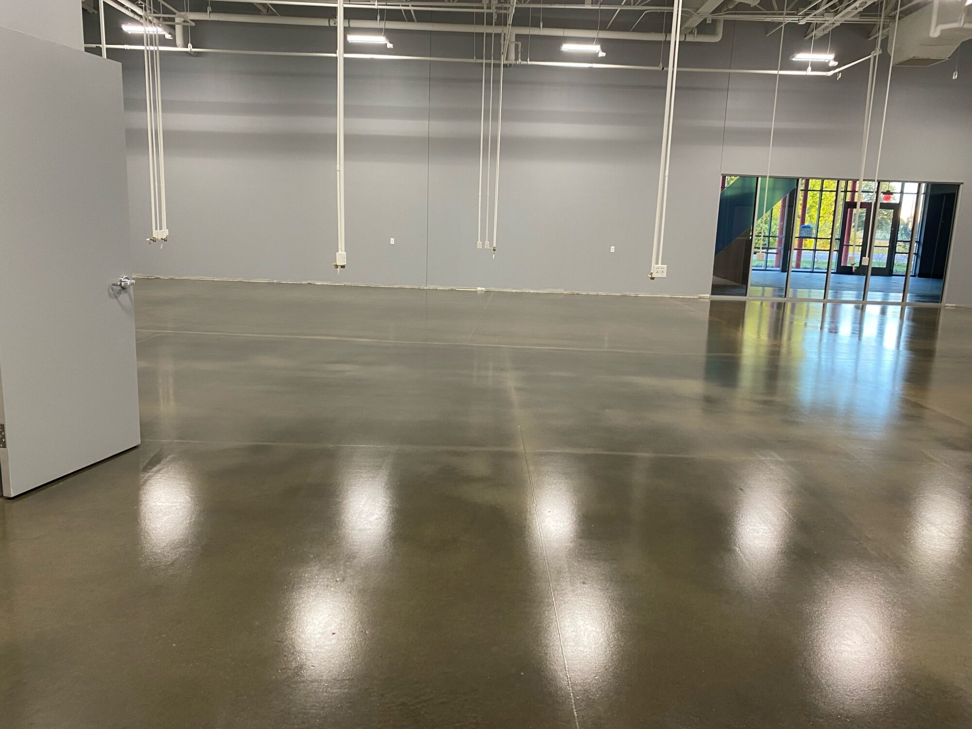 Concrete floor coatings, epoxy floor coatings, epoxy coatings, Industrial Applications Inc, TeamIA, epoxy floor coating, educational center flooring, educational epoxy flooring