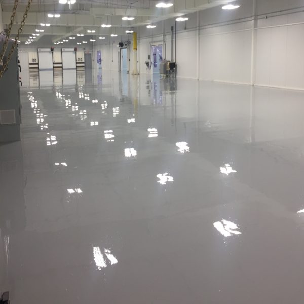 4,000 sq foot industrial maintenance shop floor - demoed the existing floor coatings, shot blasted to prep the area, saw cut and filled the floor joints, made repairs, keyed in drains, and applied a 4-coat epoxy mortar system resulting in a seamless, durable, chemical and impact resistant floor that can tolerate the heavy usage of an industrial maintenance shop