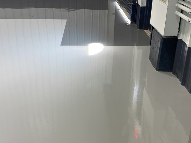 Near exterior door - urethane topcoat, high traffic area installed - highly reflective finish