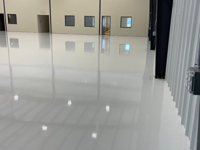 airplane hanger with new white epoxy coatings installed with urethane for high wear
