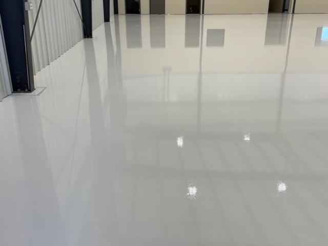Epoxy flooring with urethane top coat for shine and durability special for airline hangers