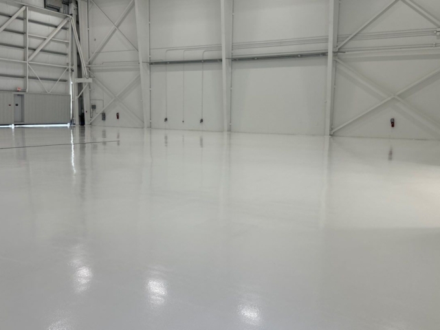 Epoxy/urethane coating systems will hold up against the heavy traffic of planes and pushback tractors