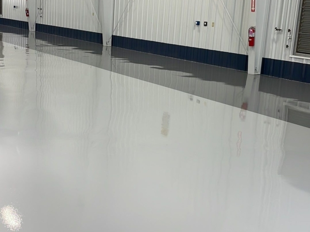 Urethane topcoat over epoxy coatings for professional airport hanger - airplane hangar floors