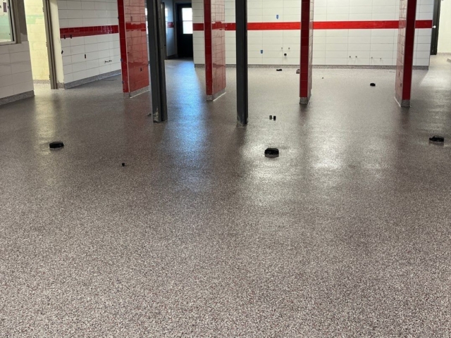 Industrial Applications, Inc. installed Silikal MMA Flake flooring systems with integral cove base to commercial kitchens.