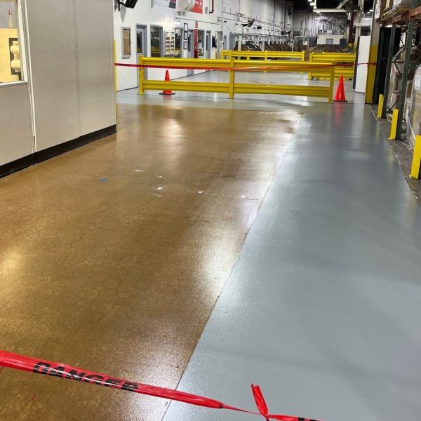 grey epoxy primer and urethane topcoat in pedestrian walkways, and clear epoxy in the main traffic aisles.