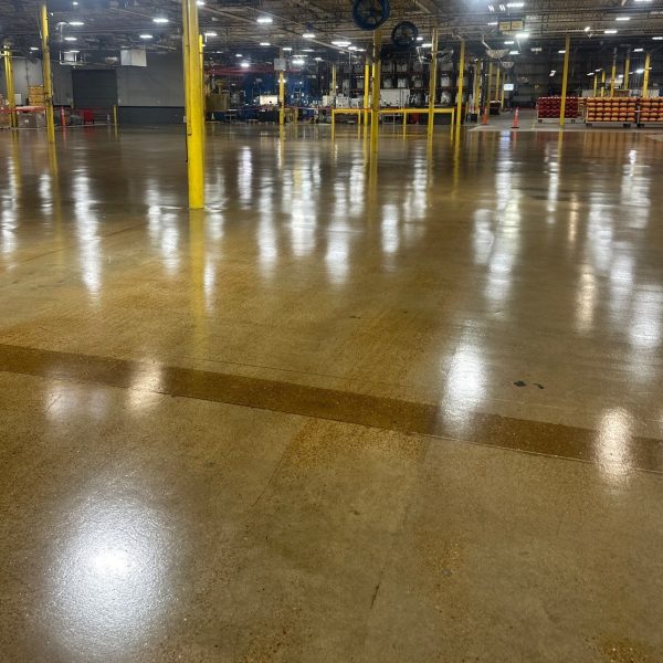 This customer was changing a production floor layout, IA removed existing line striping, patched concrete and installed epoxy primer with urethane topcoat.
