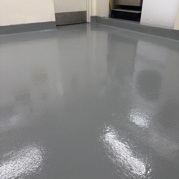 Industrial Applications, Inc.  installed Poly-Crete SL with broadcast, and applied a polyaspartic topcoat on the floor and curbs to industrial flooring.