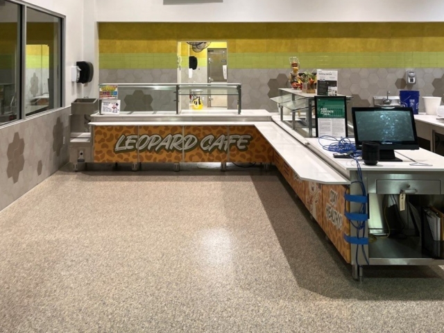 Industrial Applications, Inc. prepped the floors, primed and installed decorative flake flooring system through school&rsquo;s cafe.&nbsp;
