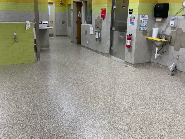 Industrial Applications, Inc. installed a decorative flake flooring system through the school's kitchen.
