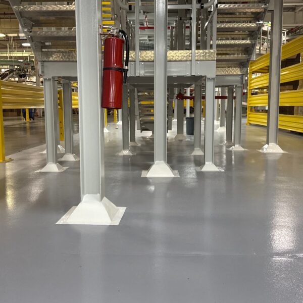 Structural column bases throughout the plant were encapsulated in 4” cant cove trowel installed with epoxy mortar. Coved bases were grout coated with clear 100% solids high-performance epoxy and topcoated with two coats of 94% solids pigmented low odor/VOC polyaspartic.