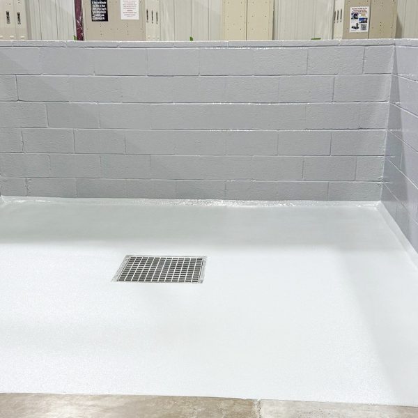 Starting with a cement block wall that was rough and in need of patching, TeamIA prepped and block filled the wall, then applied a primer, epoxy mid-coat and chemical resistant topcoat. The floor coating system included a slip resistant additive and was bordered with a hand trowelled cant cove. 