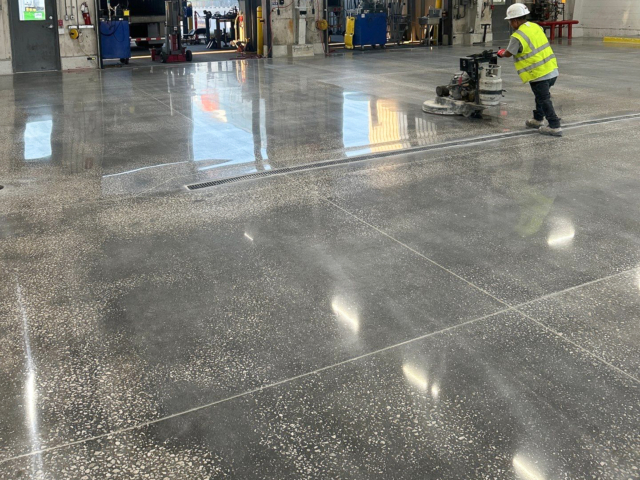 Final burnish on 800 grit polished concrete truck wash bays at a distribution center of a national retailer