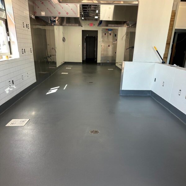 TeamIA installed a 3/16” PolyCrete Urethane Cement system with a hand-troweled integral cove base, delivering a floor designed to withstand the demands of a high-volume kitchen.