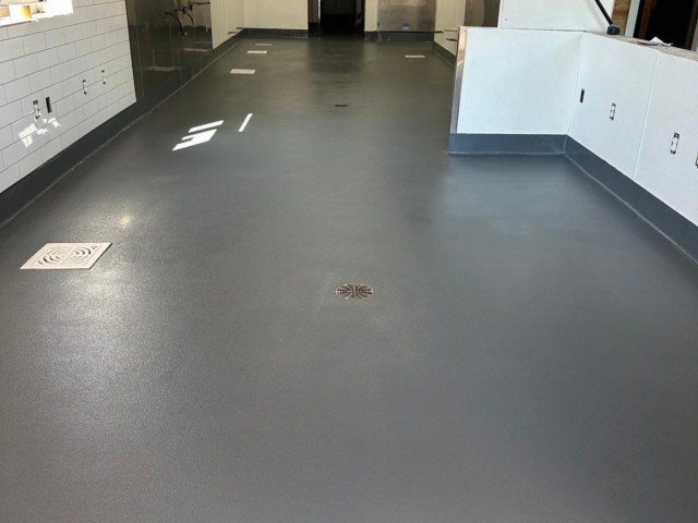 TeamIA installed a 3/16&rdquo; PolyCrete Urethane Cement system with a hand-troweled integral cove base, delivering a floor designed to withstand the demands of a high-volume kitchen.