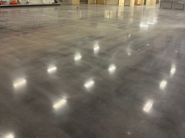 Our team removed nearly 9,000 square feet of deteriorated coating, then made structural and cosmetic repairs before dyeing and polishing the concrete to a medium-high gloss finish. Through careful planning and execution, #TeamIA delivered a clean, durable, and visually striking polished concrete surface built to perform in a demanding commercial environment.&nbsp;