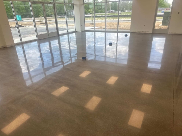 Office areas - we polished the concrete to an 800 grit high-gloss finish, creating a bright, reflective surface that enhances lighting and elevates the overall feel of the space