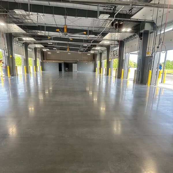 Constant warehouse traffic demands were a fit for a  400 grit polished concrete satin finish, delivering a more subtle look while providing the durability and slip resistance needed for daily operations.