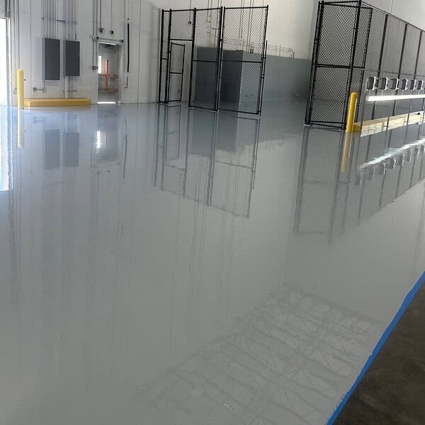 Industrial Applications designed and installed a customized epoxy flooring system engineered to stand up to constant forklift traffic, heavy pallet loads, and the inevitable battery acid exposure around charging stations.