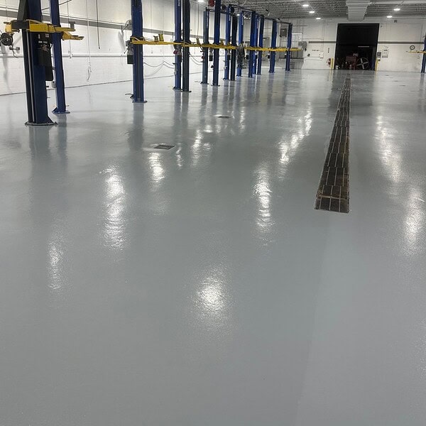 Automobile dealership service bays take a beating from continuous vehicle traffic, dropped tools and chemicals but need to play an important role in creating a professional first impression for customers and employees – IA restored nearly 14,000 square feet of heavily worn service bay flooring
