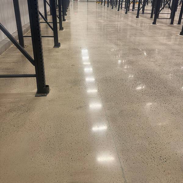 IA prepped and applied a grout coat and polished the floor to a durable 400-grit satin finish. The result was a clean, dust-free surface that improved housekeeping, restored functionality, and helped the facility continue serving its community without unnecessary downtime.