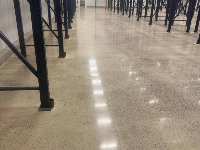 IA prepped and applied a grout coat and polished the floor to a durable 400-grit satin finish. The result was a clean, dust-free surface that improved housekeeping, restored functionality, and helped the facility continue serving its community without unnecessary downtime.
