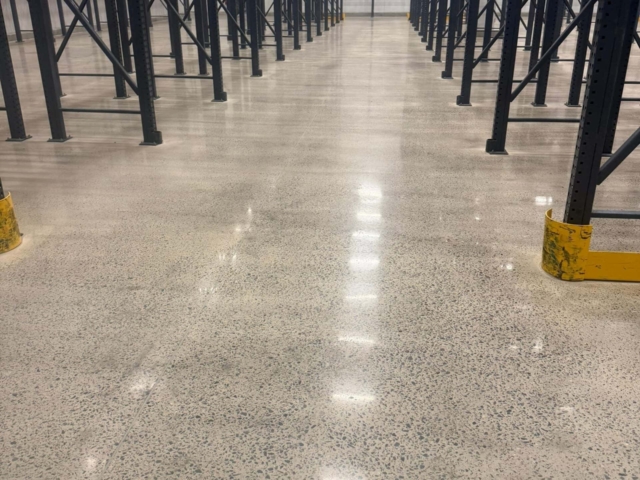 Our team mechanically cleaned, ground, and prepared the concrete before applying a grout coat and polishing the floor to a durable 400-grit satin finish. The result was a clean, dust-free surface that improved housekeeping, restored functionality, and helped the facility continue serving its community without unnecessary downtime.